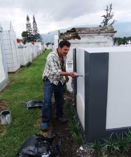 Even in the cemetery, workers prepare for vandals
